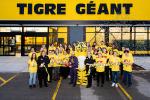 Giant Tiger Boisbriand, Que., staff members pose outside in front of the store for the official ribbon cutting. 