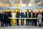 Giant Tiger Vaughan, Ont., employees and Giant Tiger President and CEO, Gino DiGioacchino, do the official ribbon cutting in front of the store. 