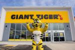 Friendly, the Giant Tiger poses in front of a Giant Tiger store. 