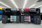 Giant Tiger Boisbriand, Que., featuring a layout of women’s bathing suits, coverups, beach towels, and an assortment of rubber sandals. 