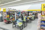 Giant Tiger Vaughan, Ont., aisle featuring items such halls, body spray, toilet paper, paper towel, deodorant, shampoo, and conditioner are being displayed. 