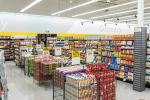 Giant Tiger Vaughan, Ont., grocery section featuring bins of Tim Horton’s coffee, snacks, napkins, and reusable plates. The word “Grocery” is displayed over the shelves of food.