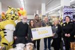 Friendly, the Giant Tiger, Ottawa Councillor Jeff Leiper, Parkdale Food Centre staff, hold a $500 presentation cheque with three Giant Tiger Hintonburg employees. 