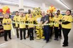 Giant Tiger Hintonburg employees pose for a photo with Friendly, the Giant Tiger during the official ribbon cutting ceremony. 