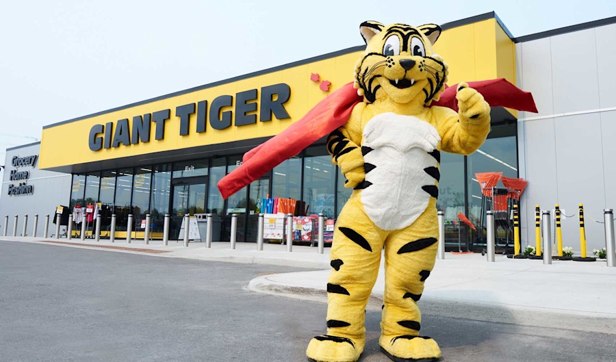 Friendly standing in front of Giant Tiger store
