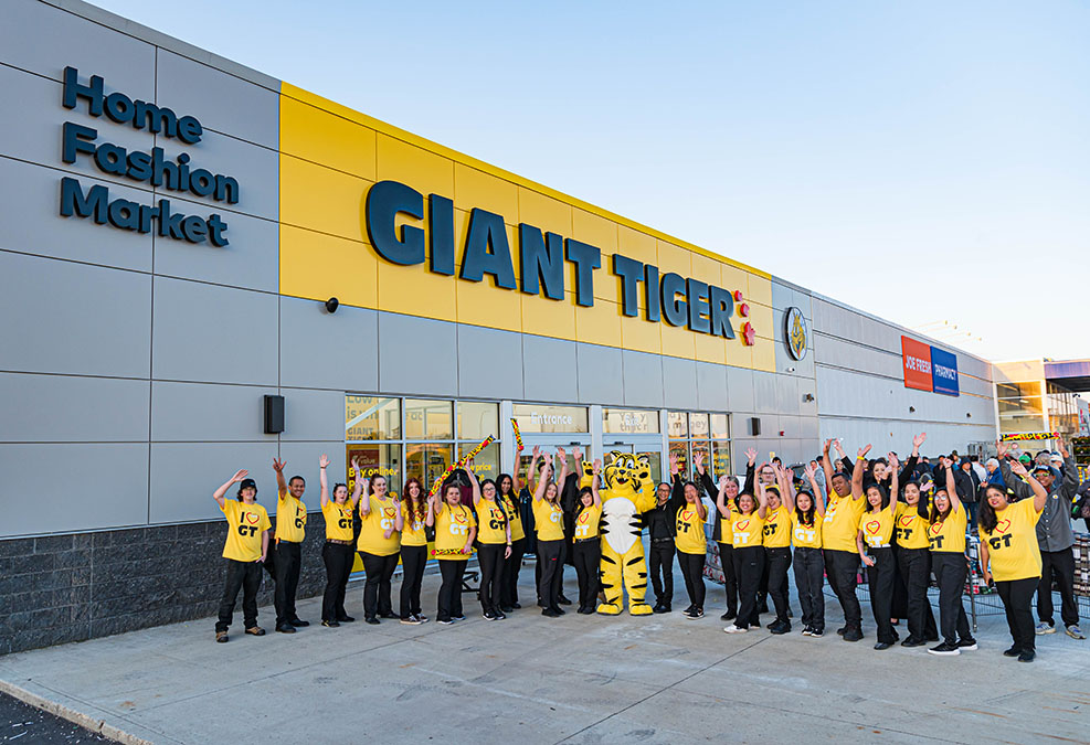 Employees in front of Giant Tiger store
